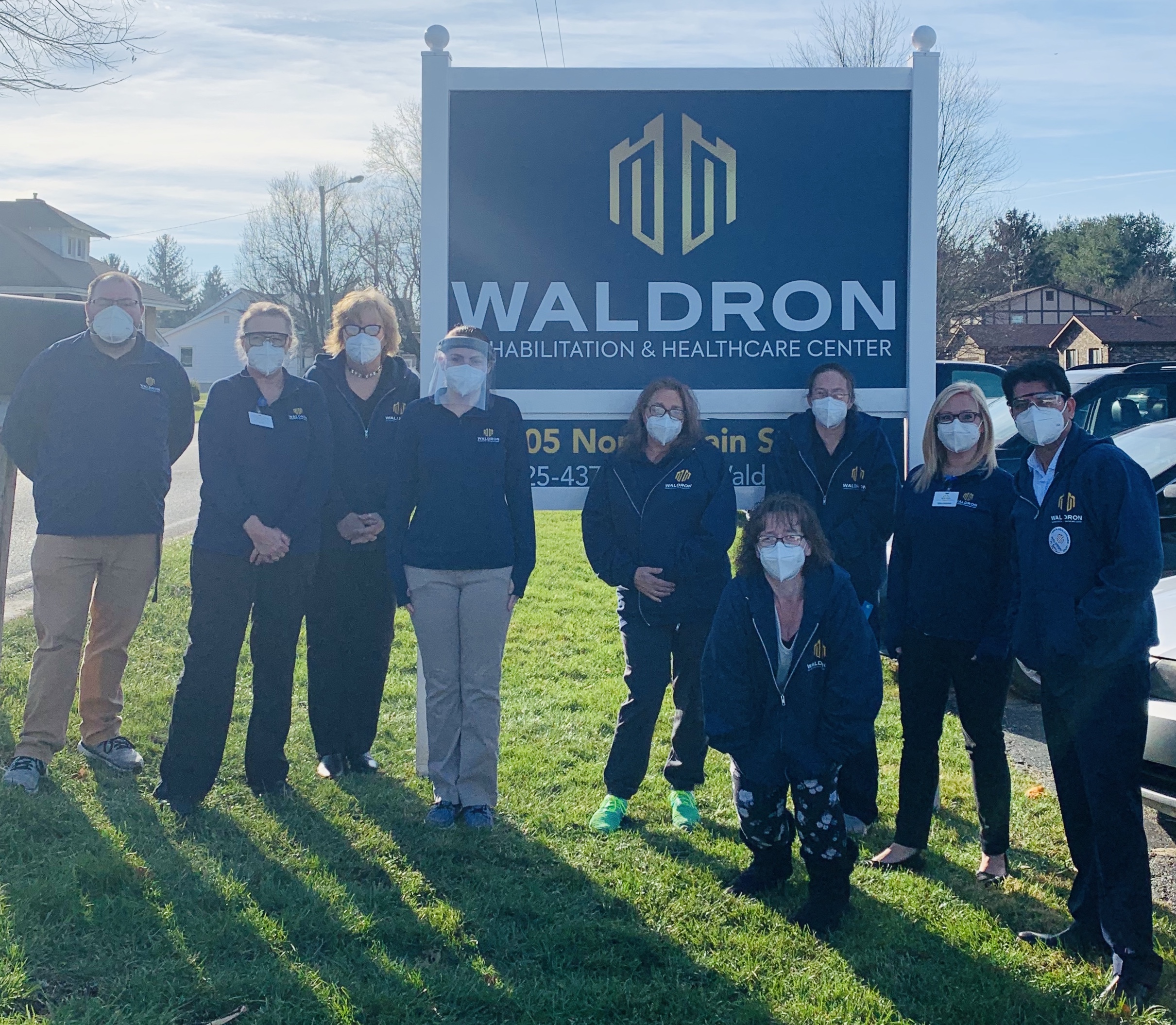Waldron Staff By New Sign