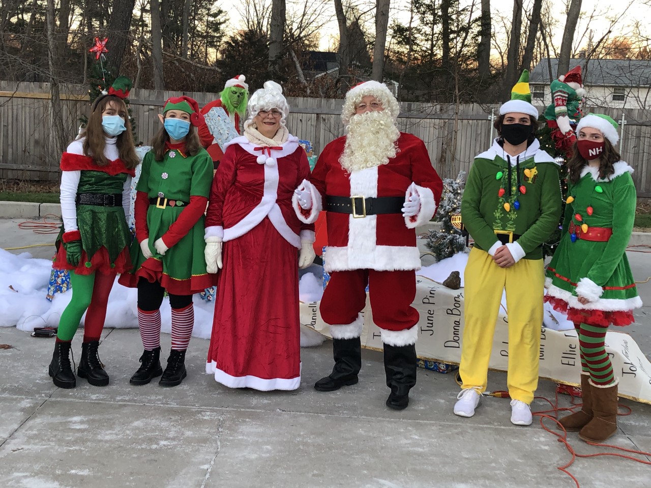 Santa Claus, Mrs. Claus, and their elves.