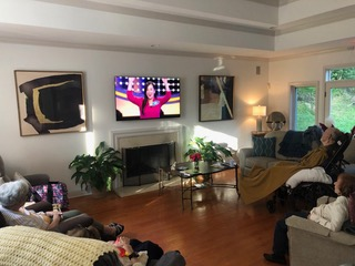 Residents sitting and watching TV together