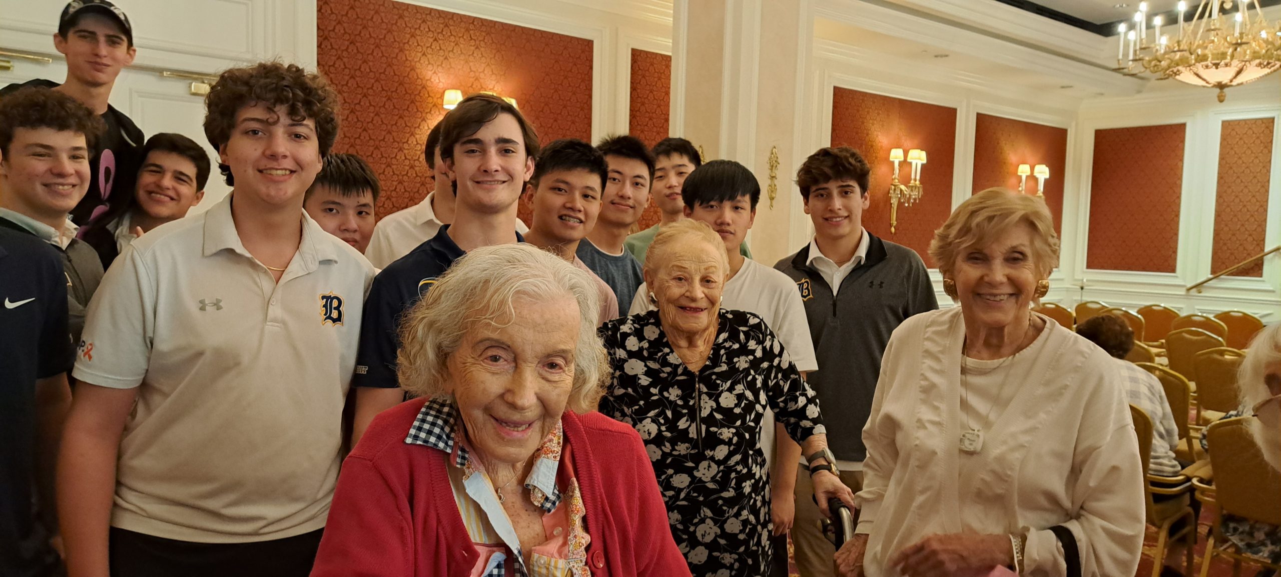 The students and some residents posing for a photo